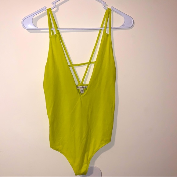 Express Tops - Neon yellow cross back body suit from Express